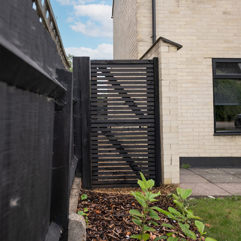 Lifestyle image of Larch Slatted Gate, painted black