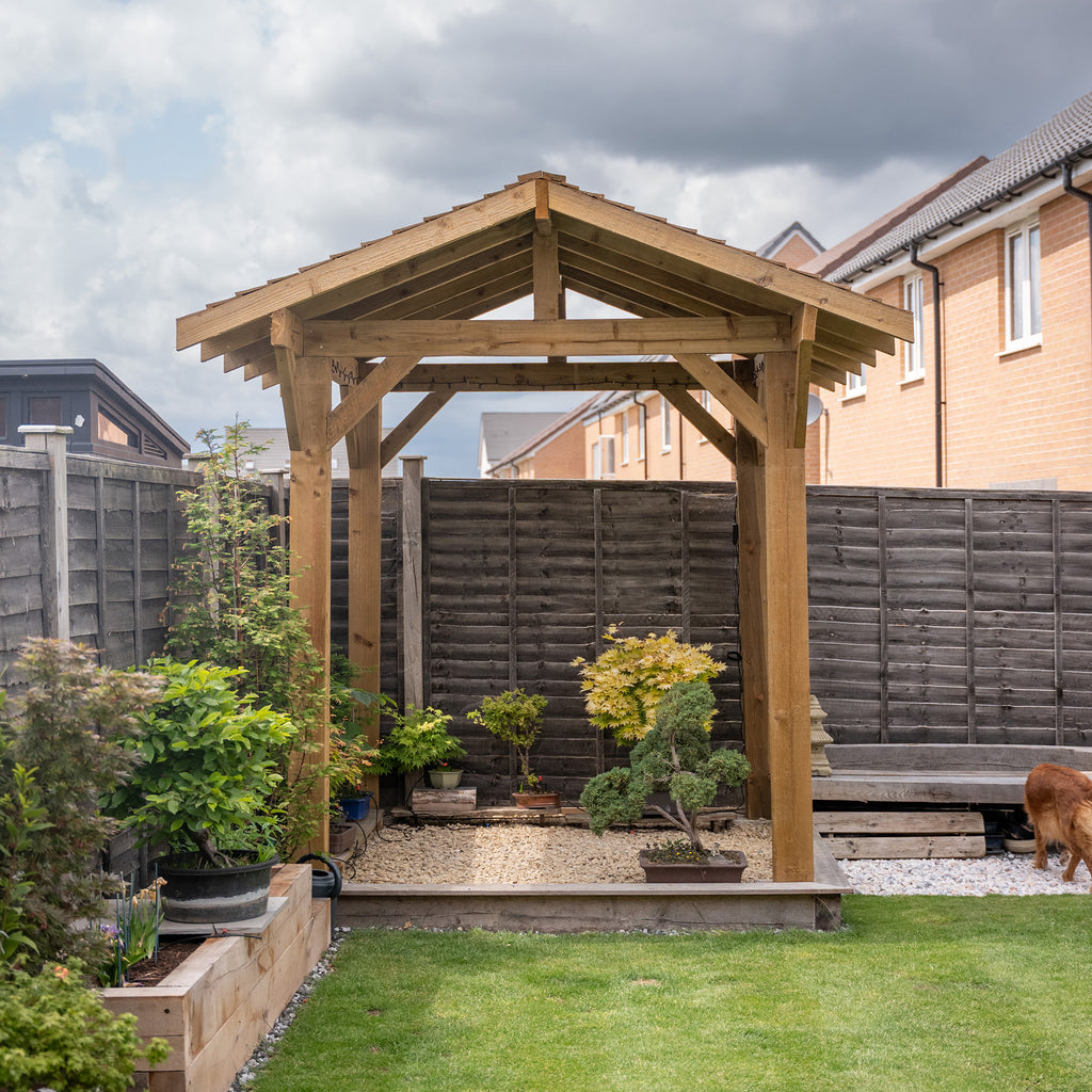 Apex design wooden gazebo with overhang used to make a Japanese style garden feature