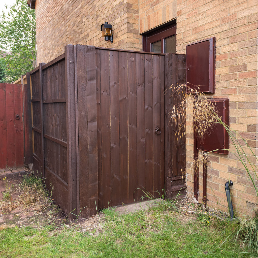 Lifestyle shot of Lynton Side Gate installed in garden