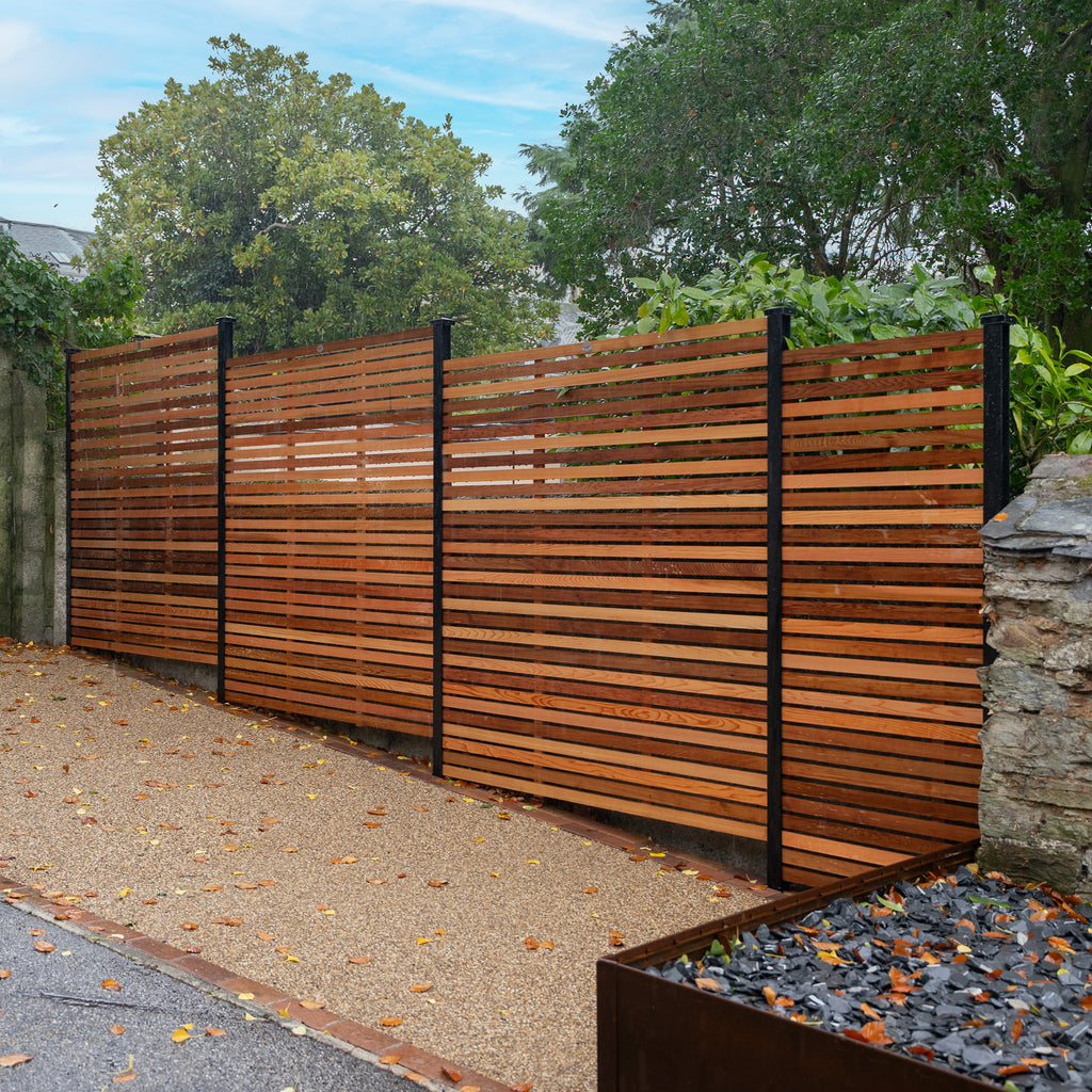Lifestyle shot of canadian cedar slatted panels, installed on a driveway