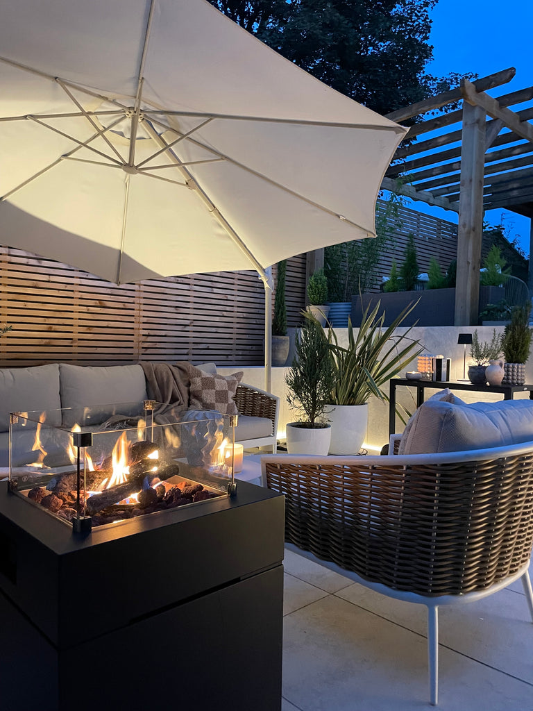 Cedar Slatted Horizontal Fence Panels in a garden at night