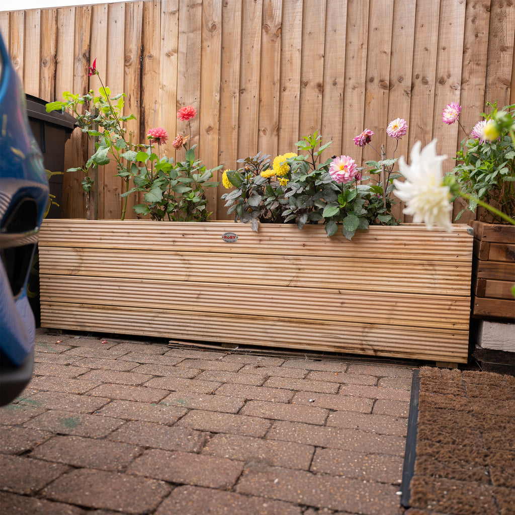 Lifestyle shot of deluxe decking planter