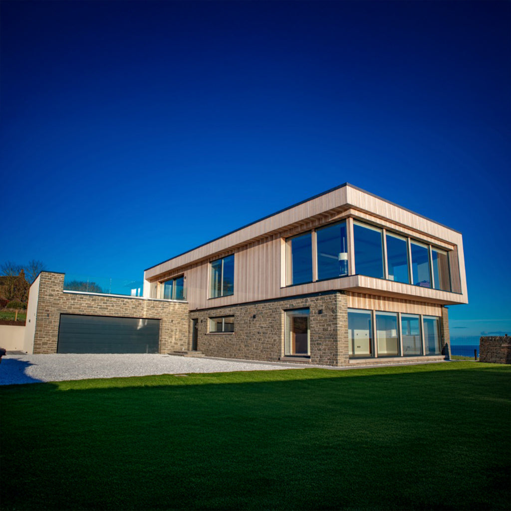 Modern house featuring European Larch Shadow Gap cladding