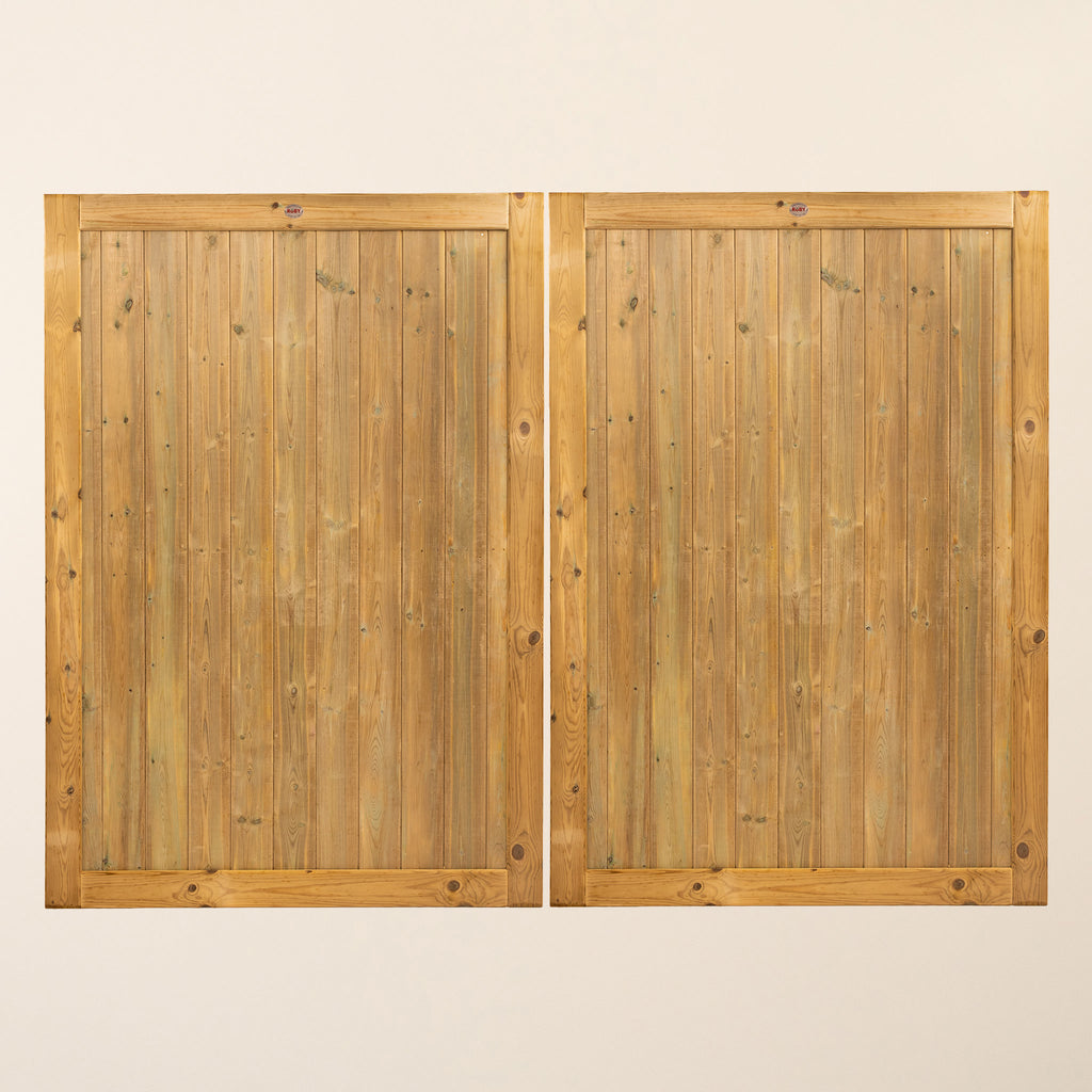 Croyde Garage Doors featuring vertical tongue and groove panels made from pressure-treated joinery grade Scandinavian Redwood, shown in a modern design with clean lines and robust construction
