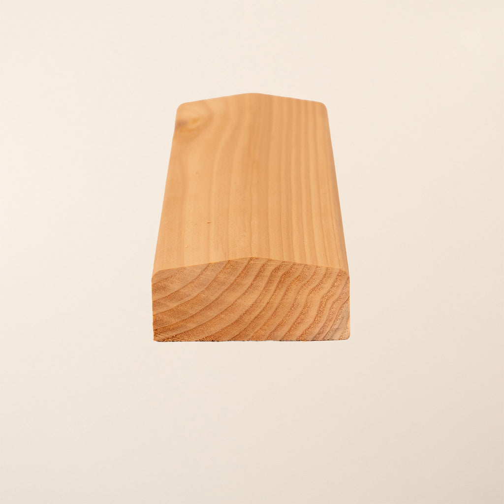 Premium British Cedar slatted panel capping with smooth planed finish, shown in natural untreated state highlighting the wood's rich color and grain