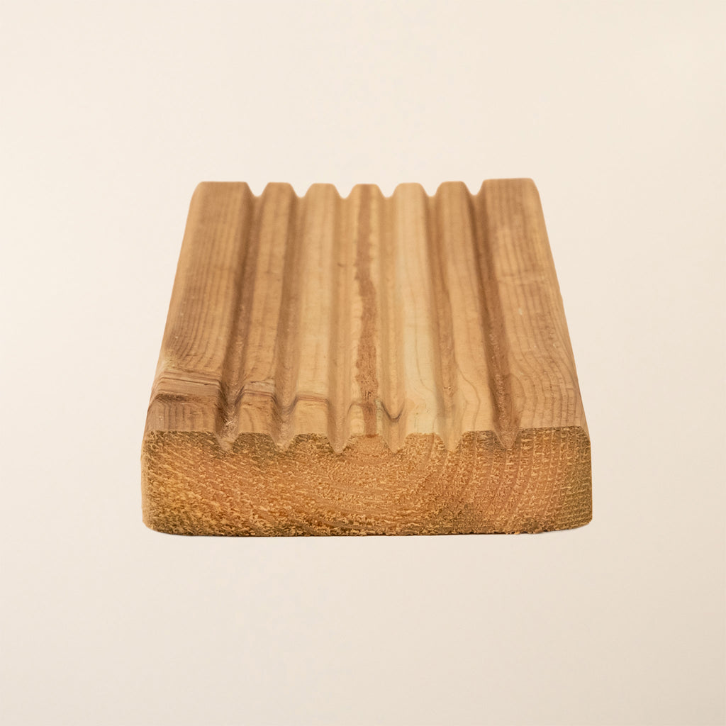 Close-up view of Premium Decking Boards showing the smooth surface texture and grain pattern of the kiln-dried softwood with green pressure treatment for outdoor durability