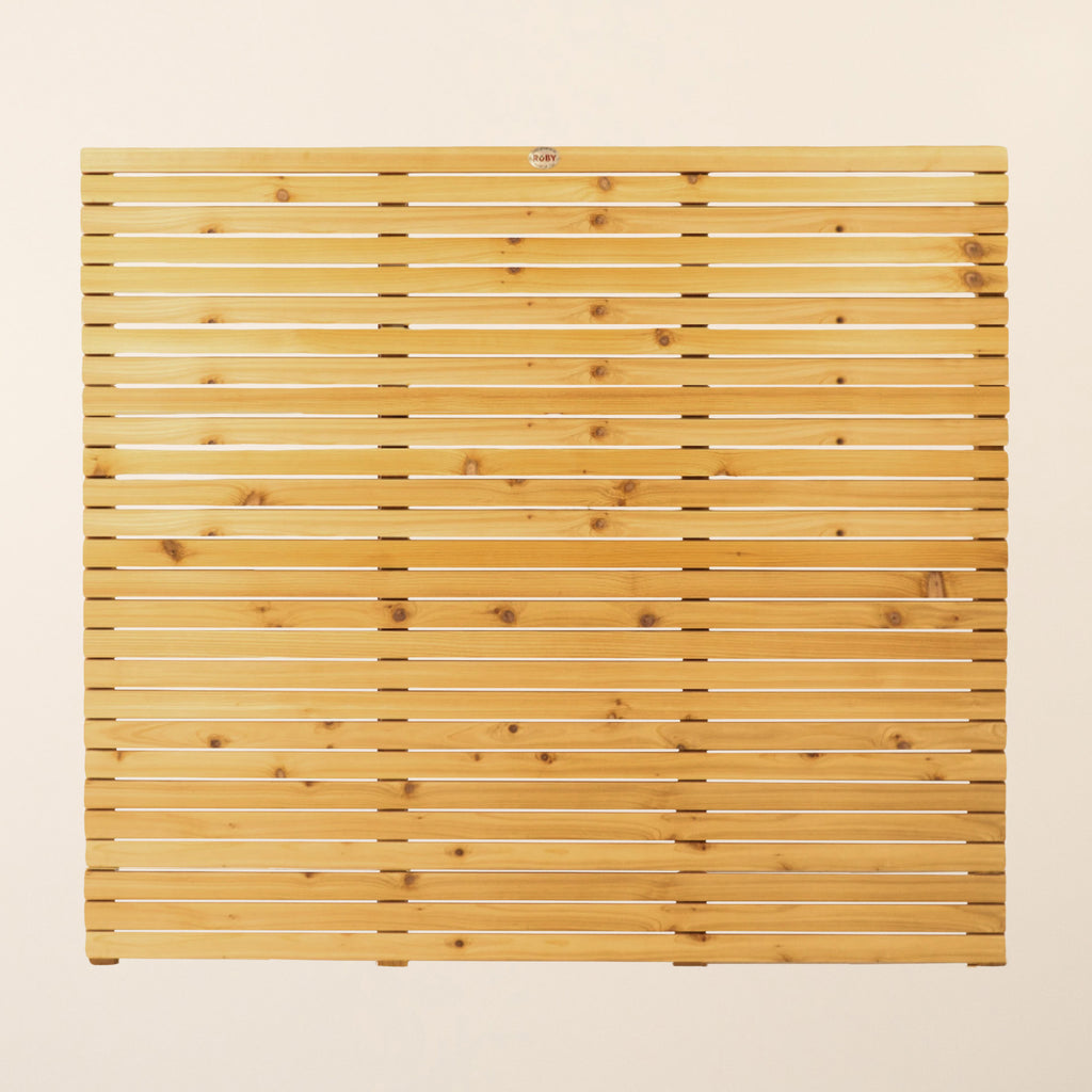 Front view of Cedar/Larch Slatted Fence Panel showing vertical 44mm x 19mm slats with narrow 6mm spacings that provide privacy while maintaining a contemporary aesthetic