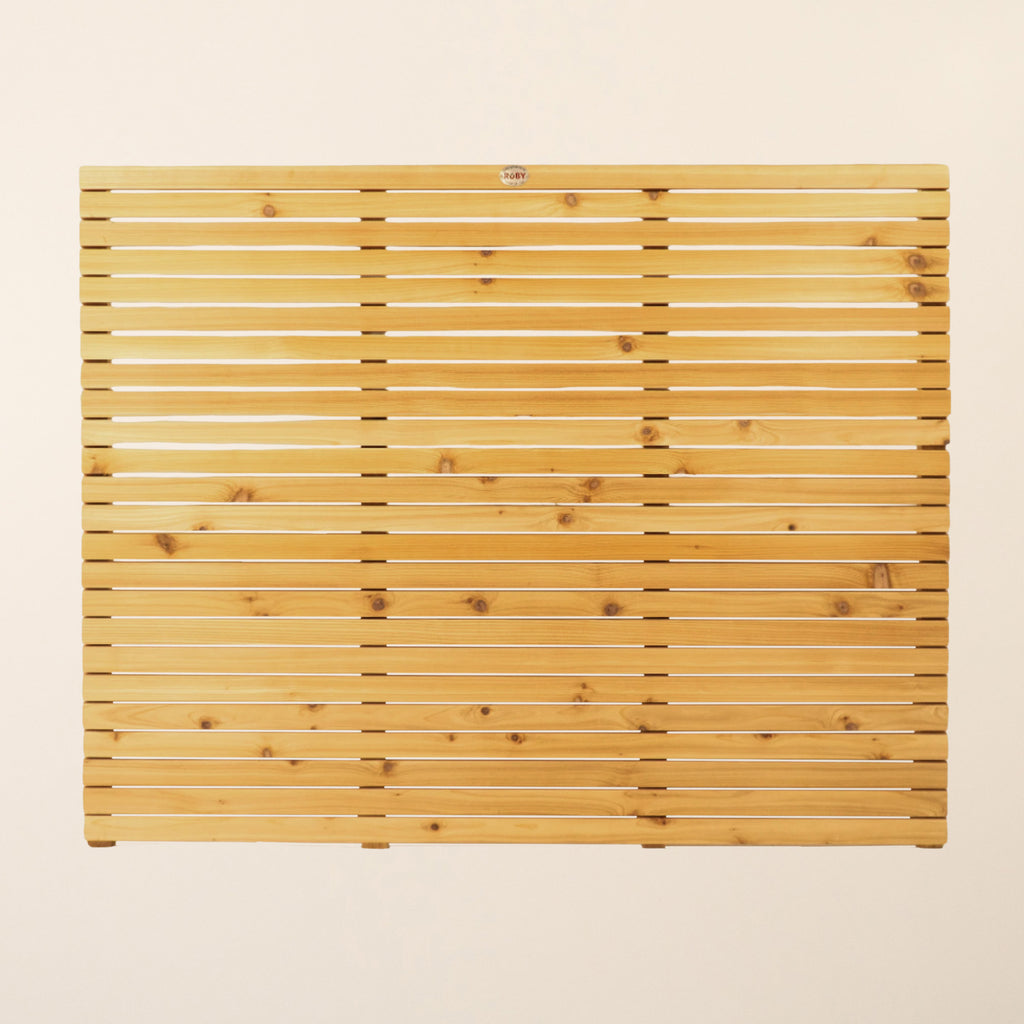Front view of Cedar/Larch Slatted Fence Panel showing vertical 44mm x 19mm slats with narrow 6mm spacings that provide privacy while maintaining a contemporary aesthetic