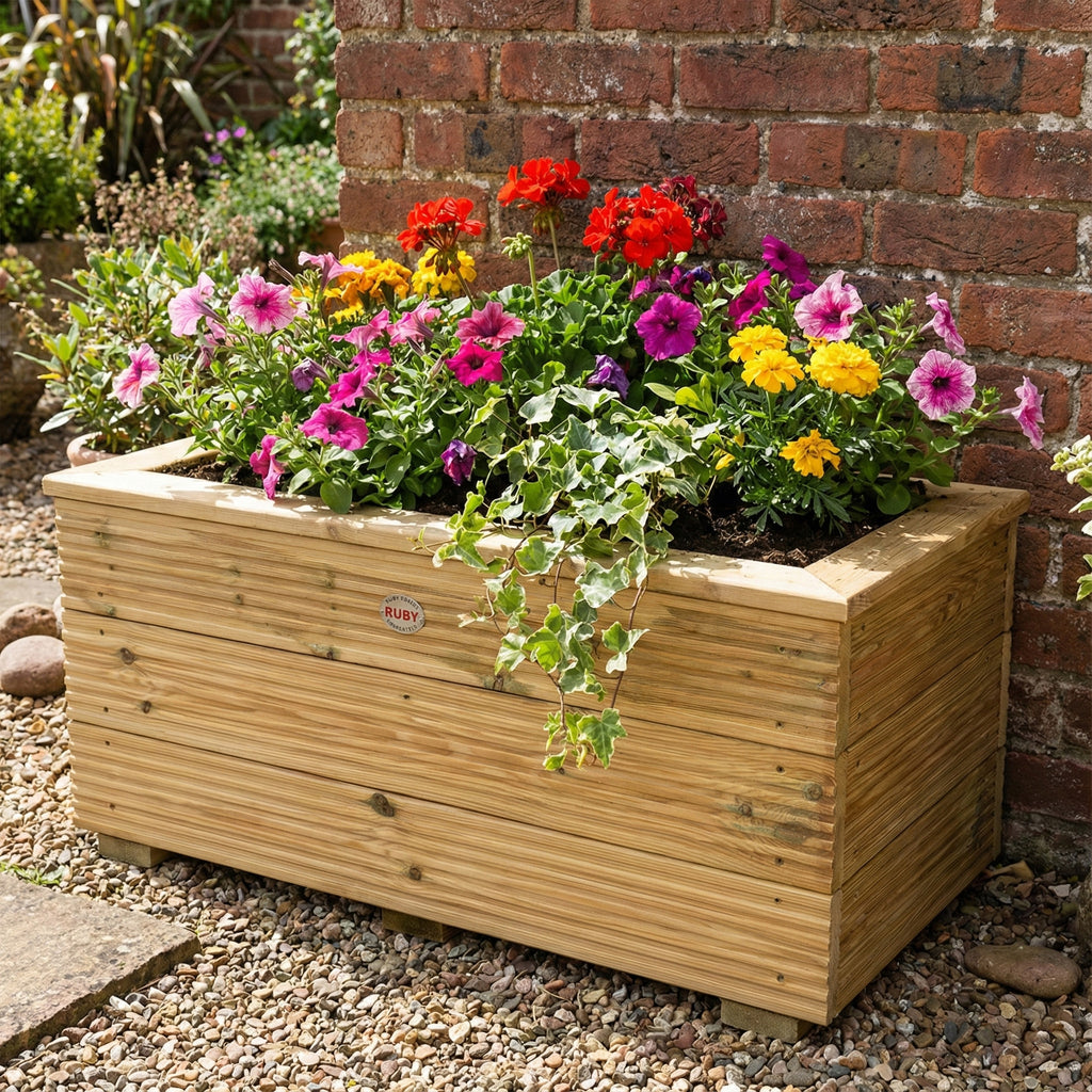 Lifestyle image of deluxe decking planter installed in garden 