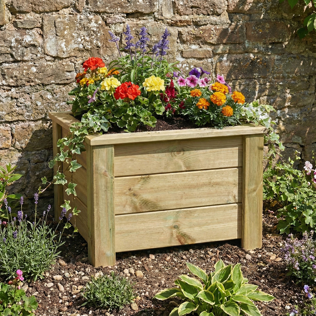 Lifestyle picture of planter installed in a garden setting 