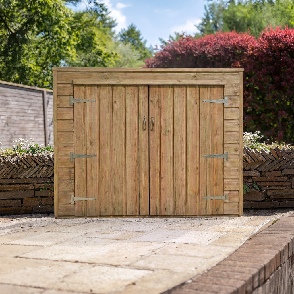 Bike shed installed in a garden setting 