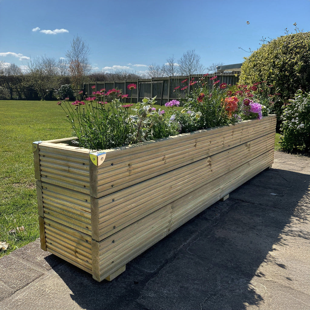 Large Deluxe Decking Planter shown from front angle, displaying premium horizontal wooden slats and generous container dimensions