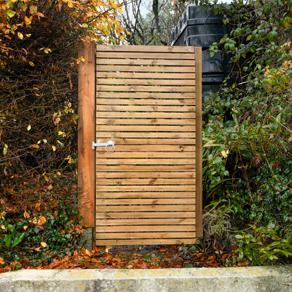 Lifestyle shot of redwood slatted gate