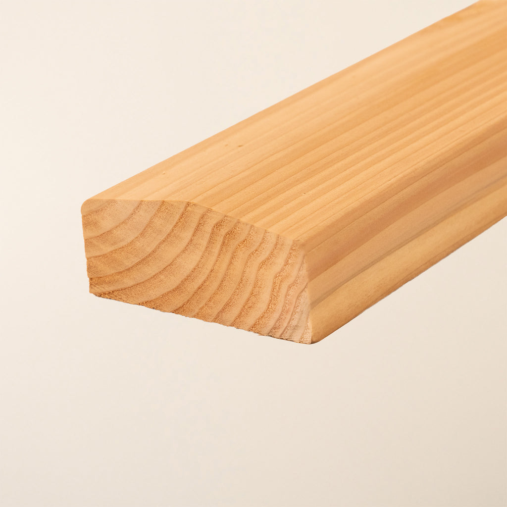 Premium British Cedar slatted panel capping with smooth planed finish, shown in natural untreated state highlighting the wood's rich color and grain