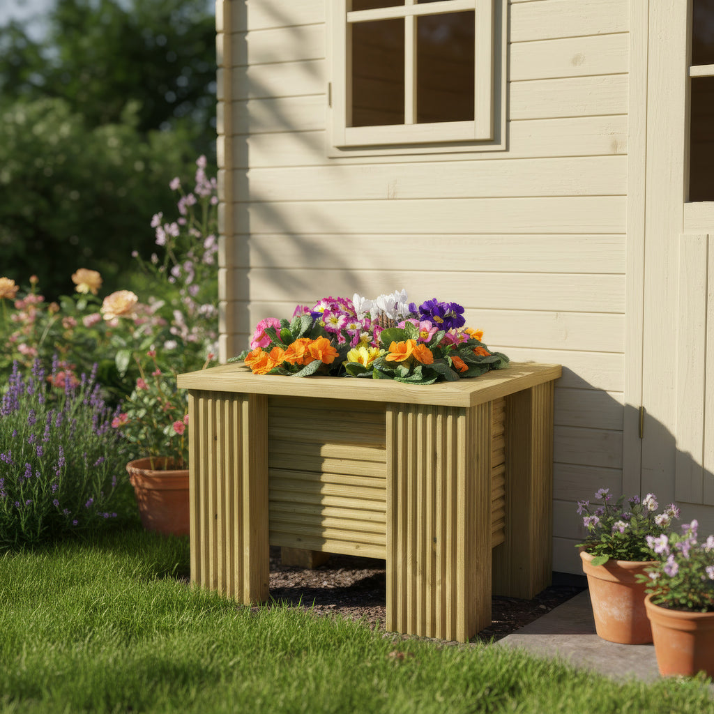 Lifestyle image of a planter installed in a garden setting 