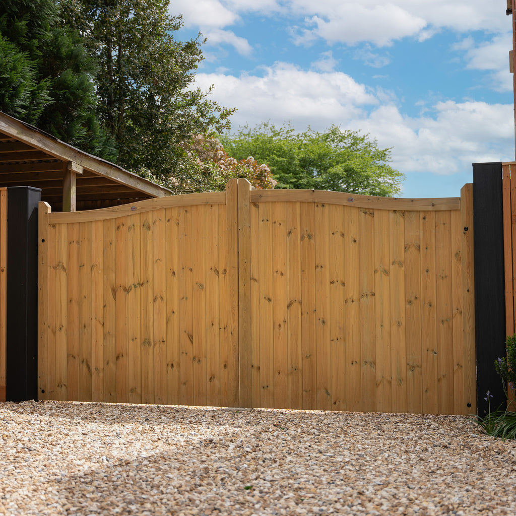 Swan Neck Gates pair in natural wood finish, showing elegant curved top design and vertical slat construction 
