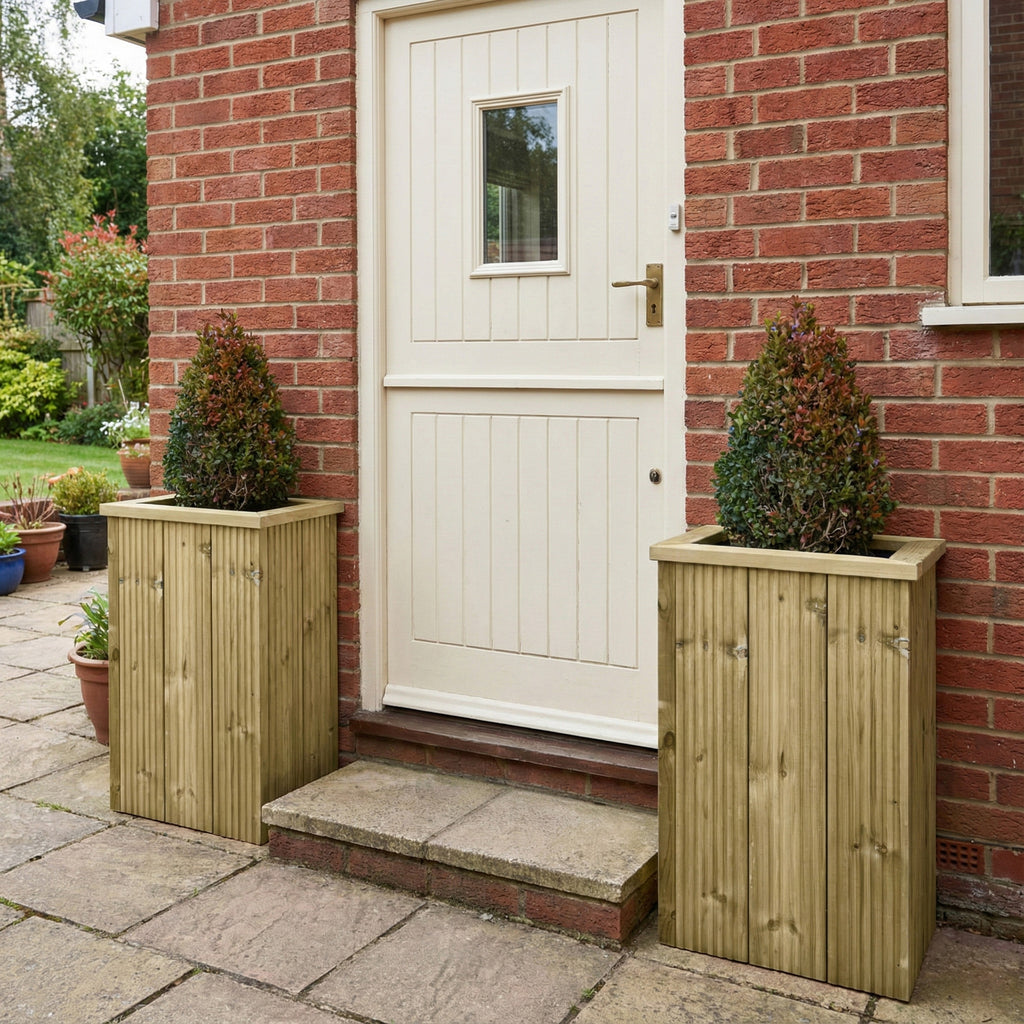 Lifestyle image of 2 planters installed by a back door 