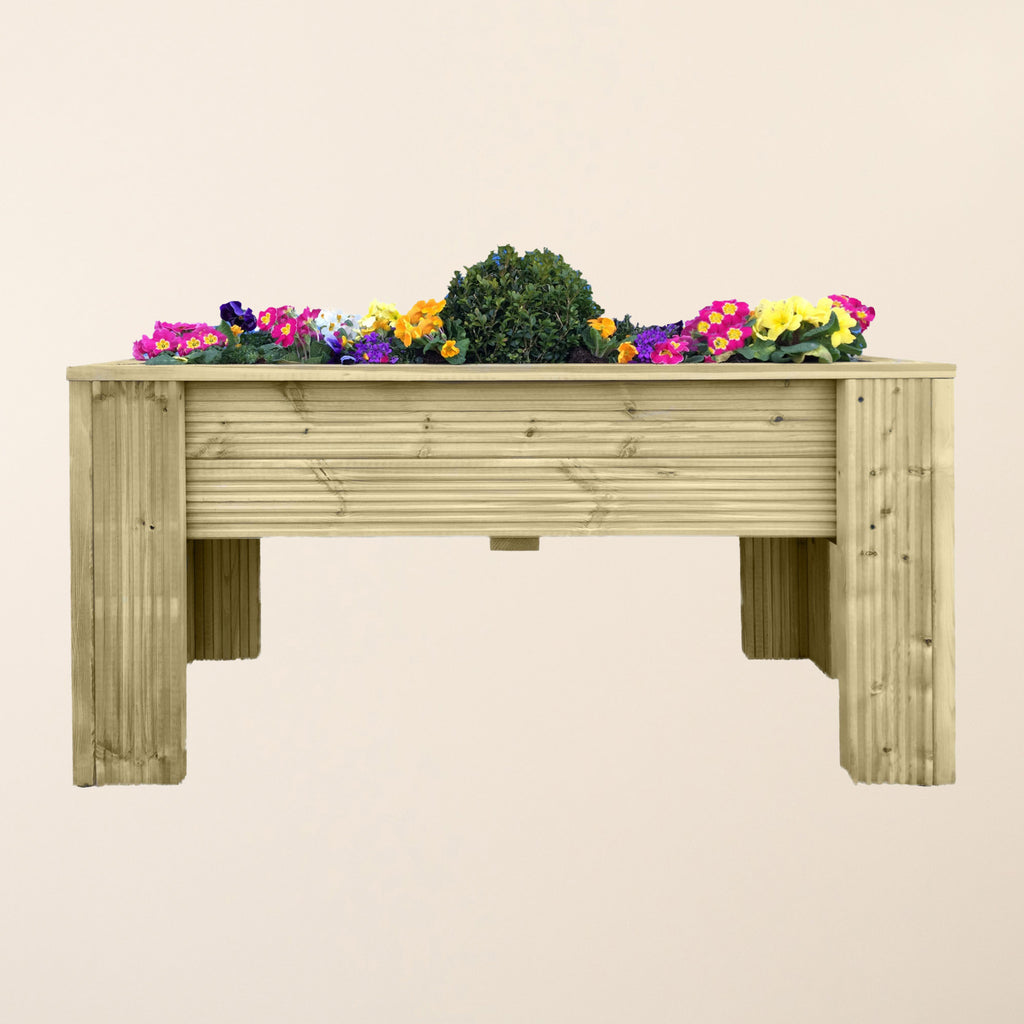 Raised garden planter filled with colorful flowers, demonstrating how the elevated height creates an attractive focal point while providing practical growing space
