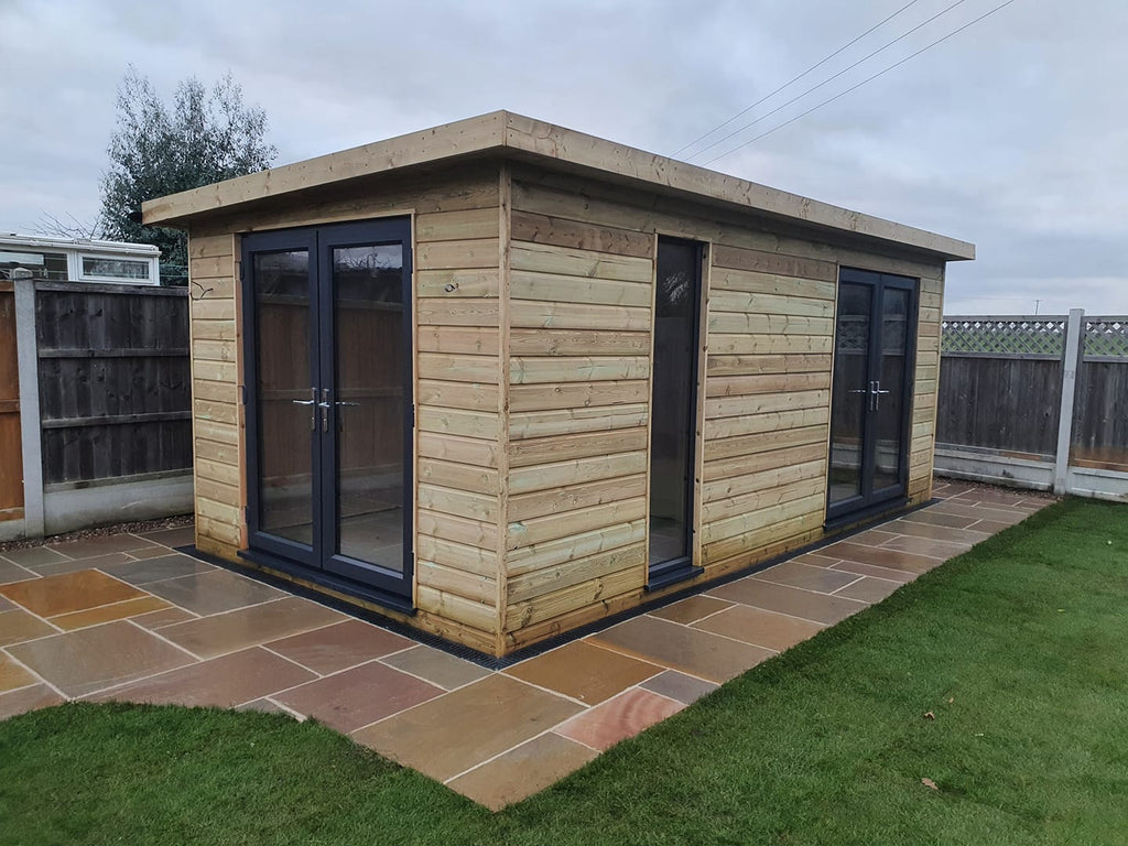 Treated timber redwood shiplap cladding cabin/garden room