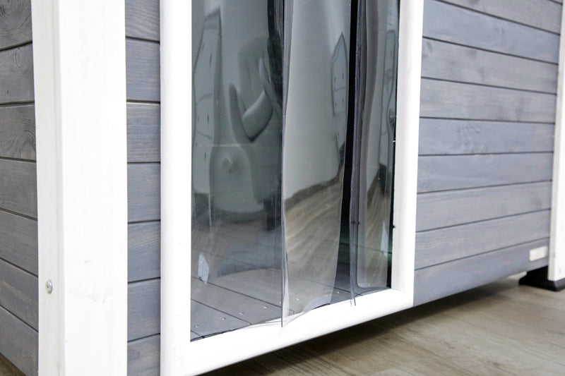 Close up of the plastic door on a grey Kerbl dog kennel