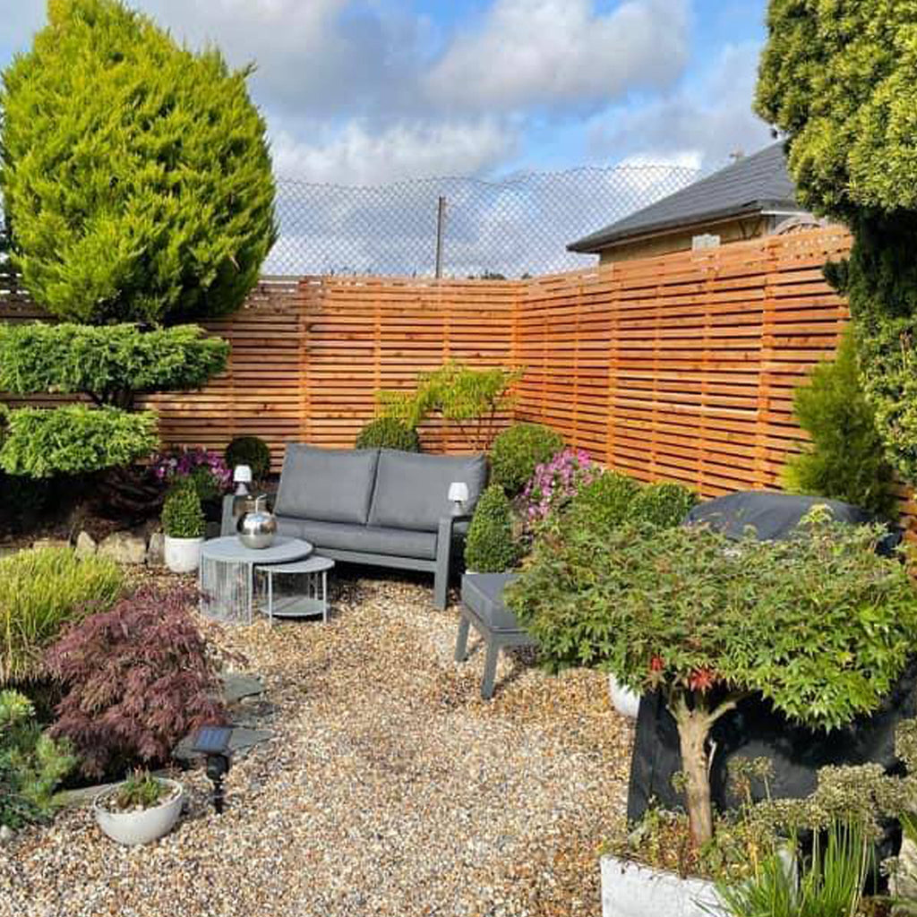 Horizontal Contemporary Cedar timber Slatted Fence Panels in customers garden