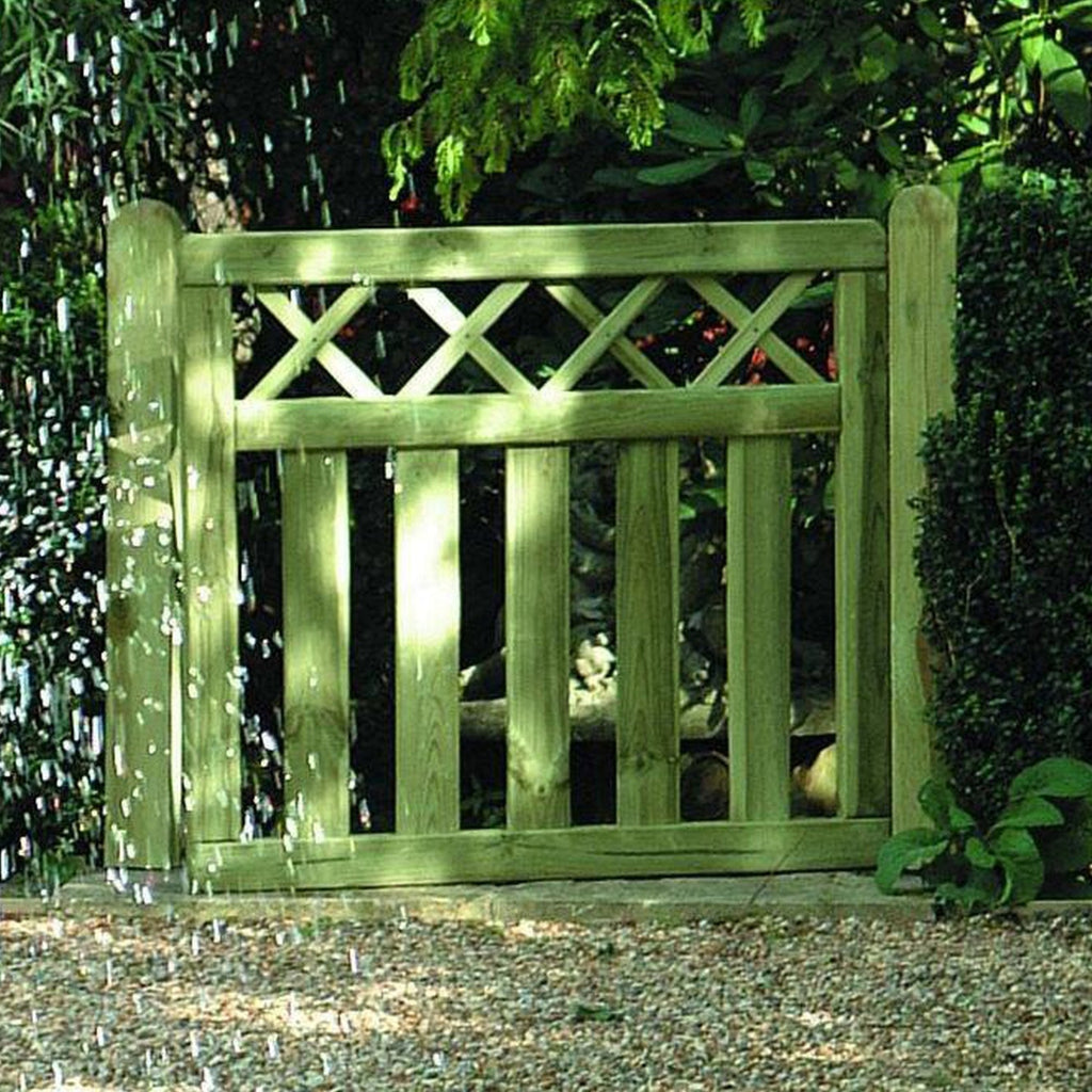 Cross Top timber Gate Displayed In Garden