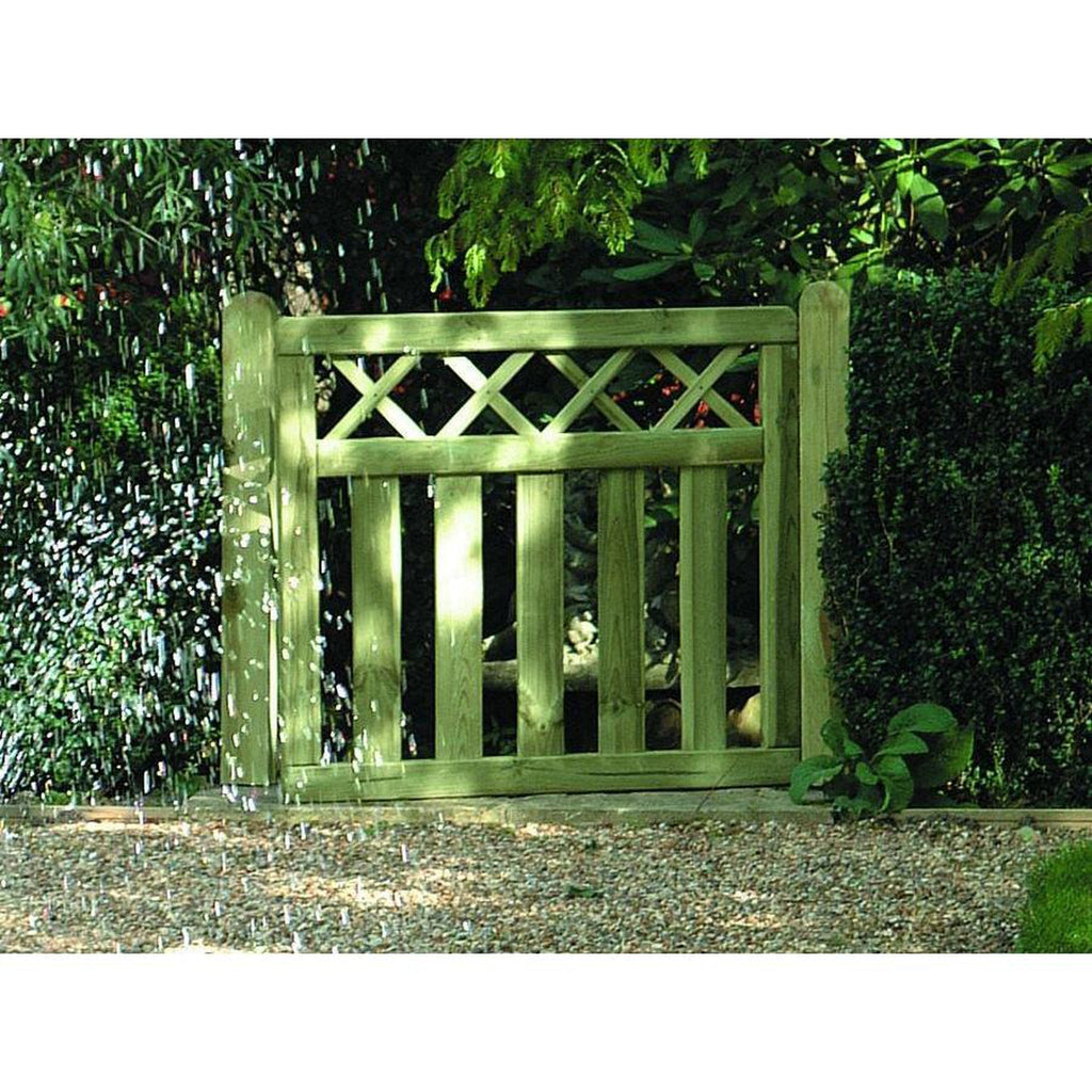 Cross Top timber Gate Displayed In Garden