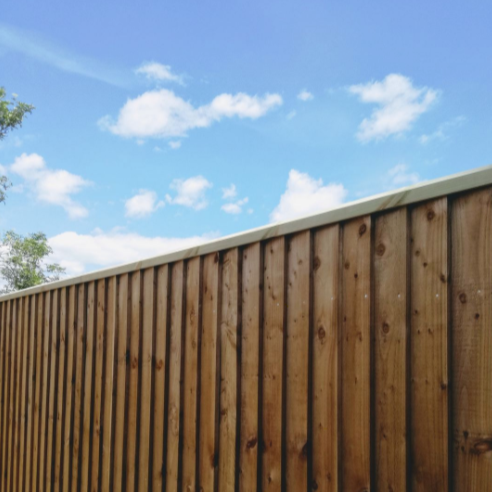 Rebated Fence Capping Rail shown on a featheredge fence