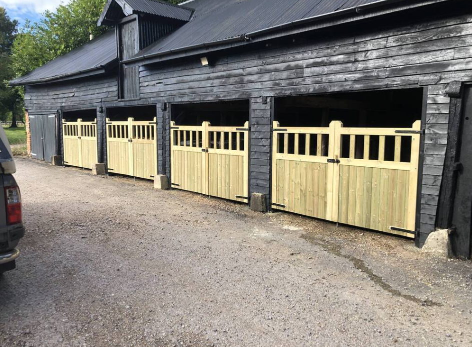 Pressure Treated Redwood timber Mortise & Tenon Driveway Gates attached to a barn
