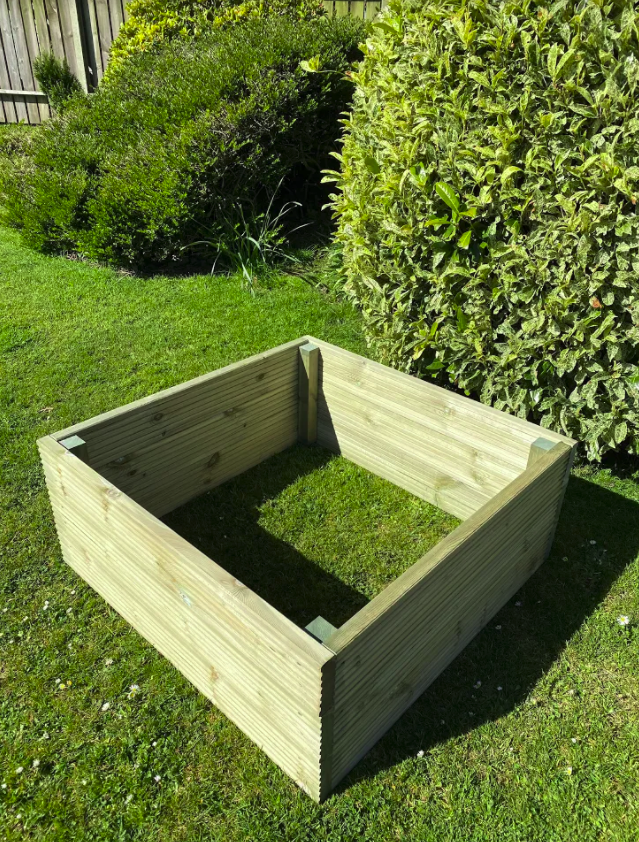 handmade raised decking planter in a garden