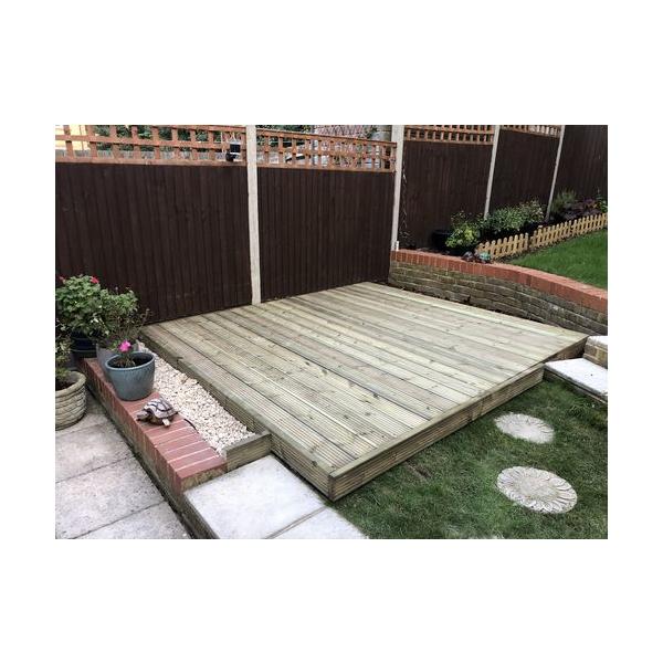 Completed Treated Redwood timber Decking Kit in a garden