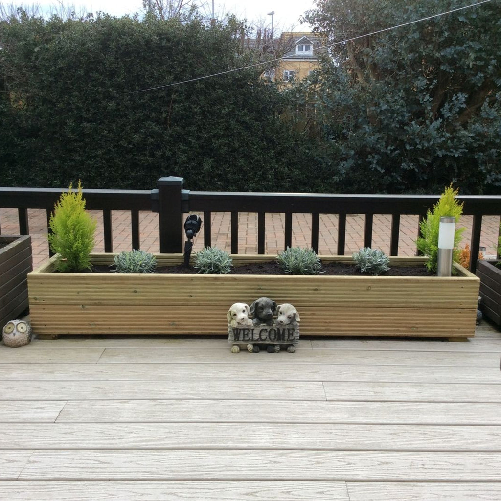 Handmade redwood timber Treated Decking Planter in a garden