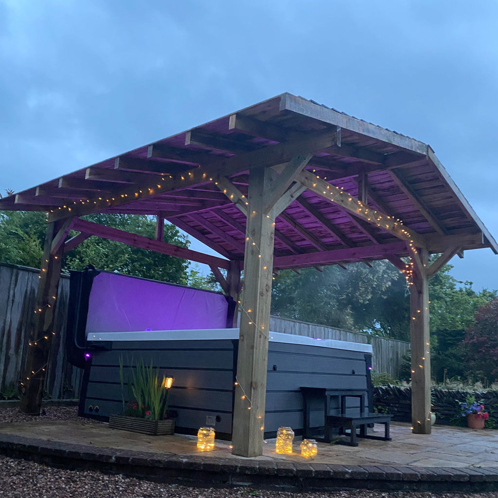 Premium Softwood Pergola With Cedar Shingles, shown covering a hot tub