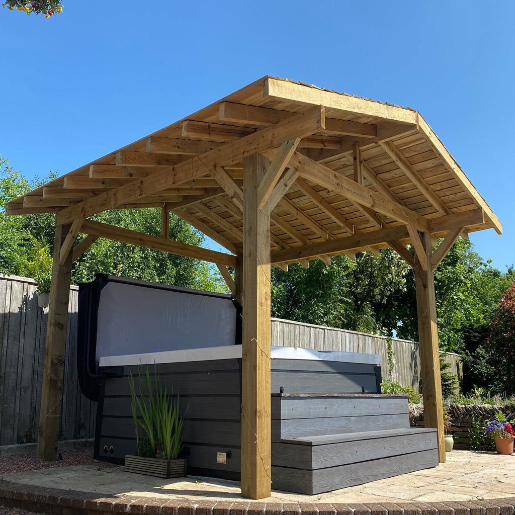 Premium timber Pergola With Cedar Shingle Roof shown around a hot tub